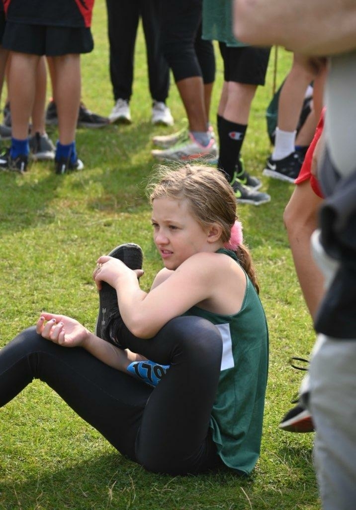 Autumn Miller stretches before Mountain West xc meet