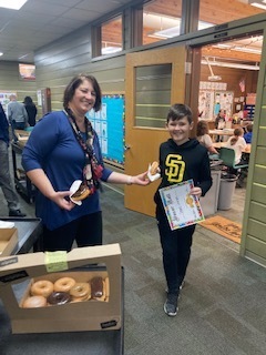 principal handing out donuts