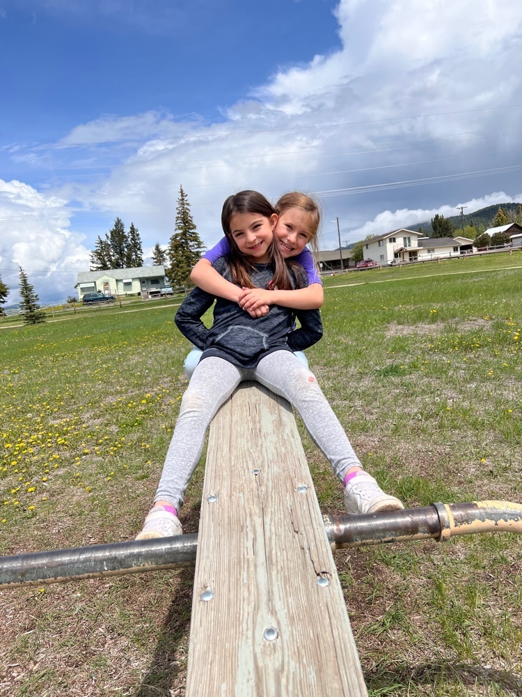 Playing on the teeter totter in Philipsburg.